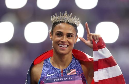 PARIS, FRANCE - AUGUST 08: Sydney McLaughlin-Levrone of Team United States celebrates winning the gold medal with the new World Record after competing in the Women's 400m Hurdles Final on day thirteen of the Olympic Games Paris 2024 at Stade de France on August 08, 2024 in Paris, France. (Photo by Julian Finney/Getty Images)